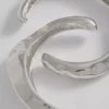 2-pakning med armbånd i smeltet metall