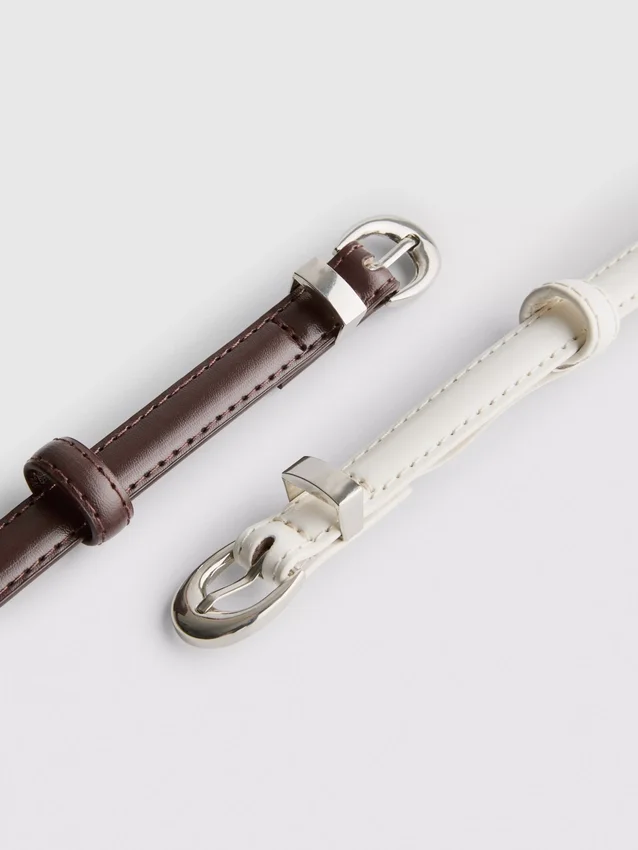 2-pakning med belter med halvmåneformet spenne