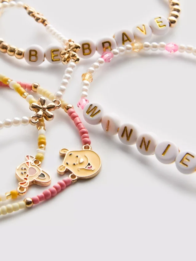 5-pakning med Disneys Winnie the Pooh-armbånd med perler og figurcharm