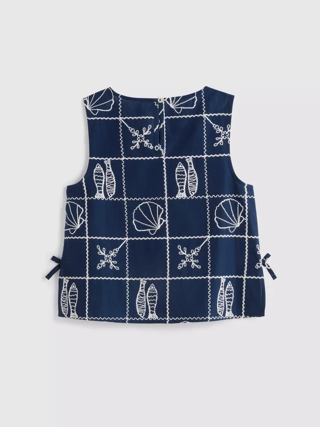 7–15 år | brodert ermeløs bluse