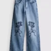 7–15 år | Jeans med brede ben og brodert blomsterbue