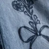 7–15 år | Jeans med brede ben og brodert blomsterbue