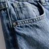 7–15 år | Jeans med brede ben og brodert blomsterbue