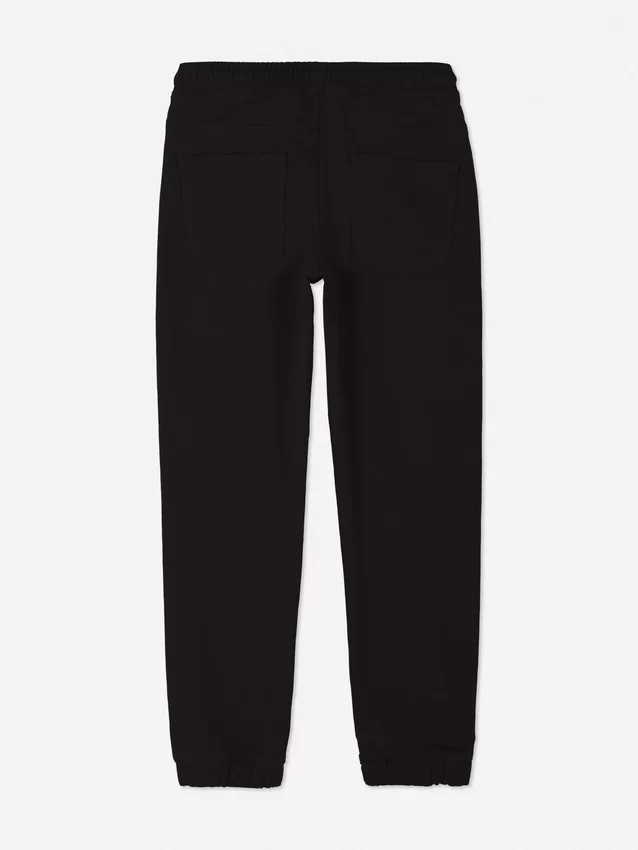 7–15 år | Jeans med oppbrettede bukseben