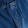 7–15 år | Jeans med oppbrettede bukseben