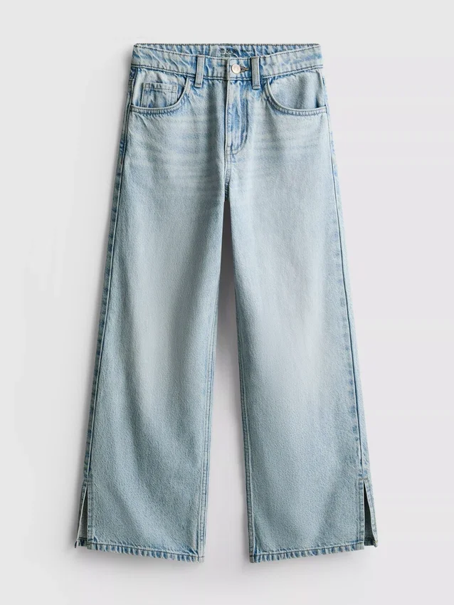 7–15 år | Jeans med splitt i buksebenet og vide ben