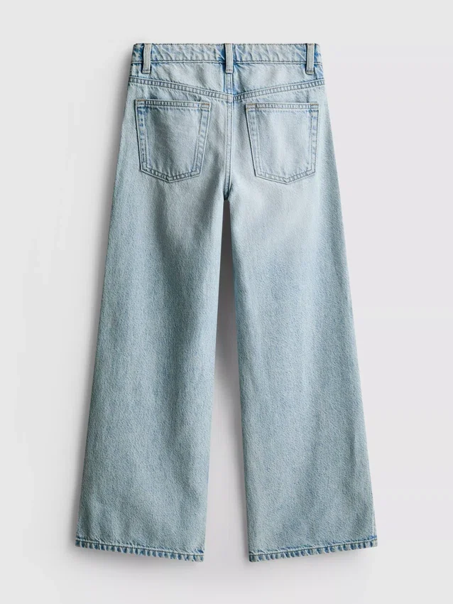 7–15 år | Jeans med splitt i buksebenet og vide ben