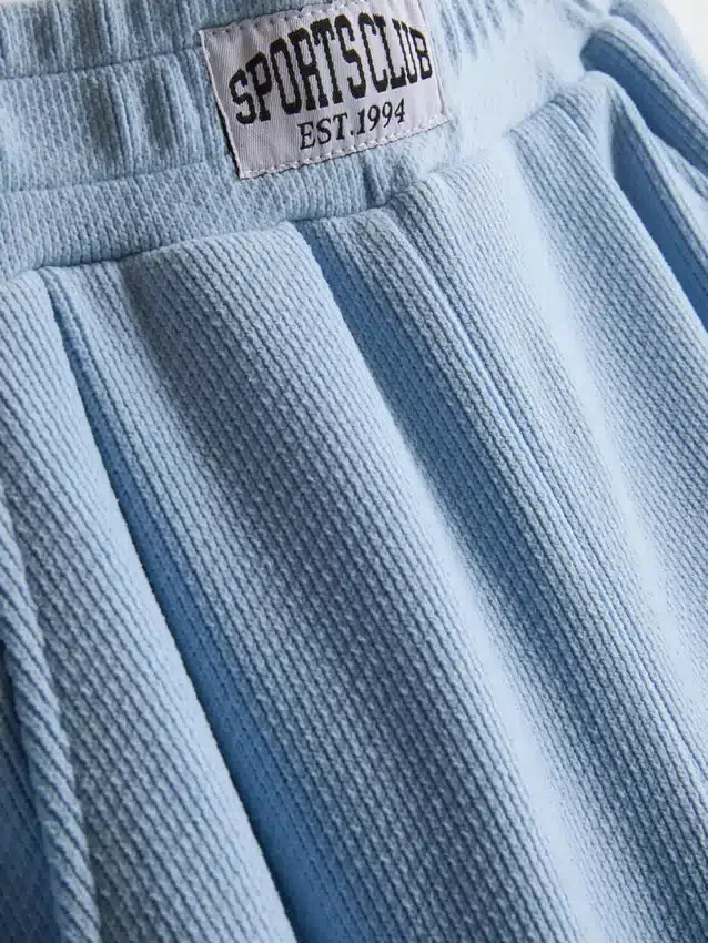 7–15 år | Joggebukser med børstet stoff og vide ben