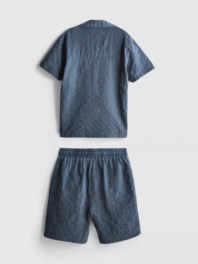 7–15 år | sett med strukturert kortærmet skjorte med knapper og shorts