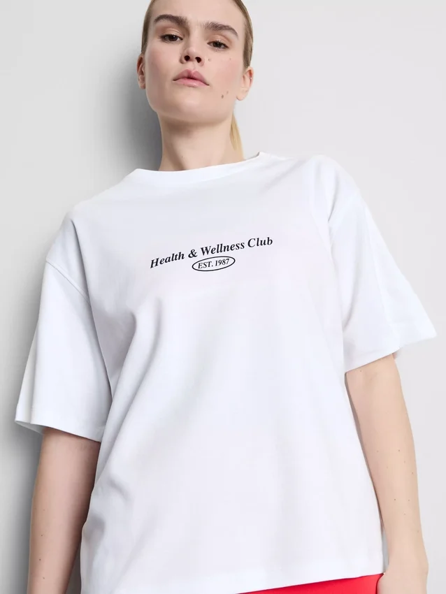 Avslappet bomulls-T-skjorte med grafisk trykk