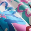 Badeshorts med blomstermønster og graffitiprint