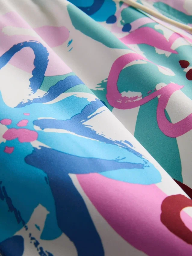 Badeshorts med blomstermønster og graffitiprint