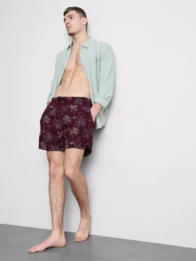 Badeshorts med brodert palmetre