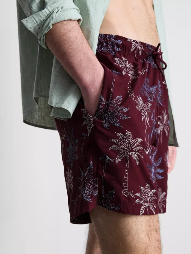 Badeshorts med brodert palmetre
