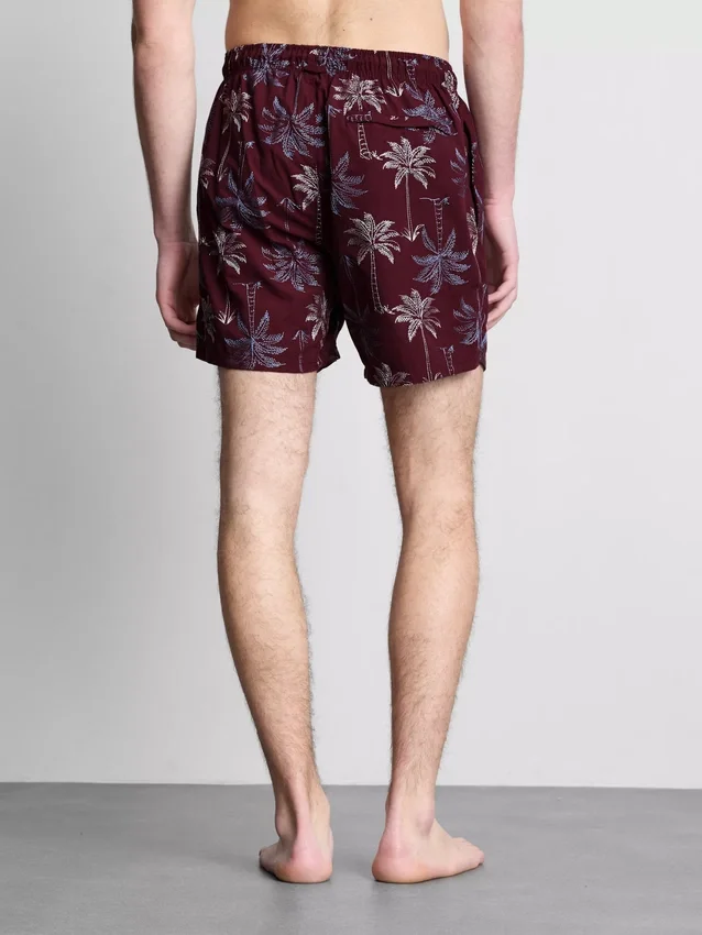Badeshorts med brodert palmetre