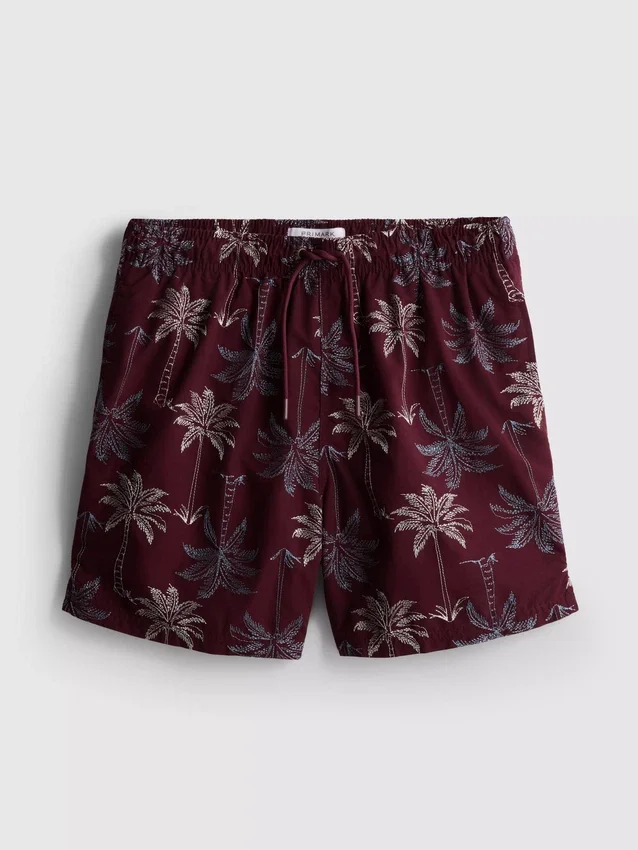 Badeshorts med brodert palmetre