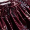 Badeshorts med brodert palmetre