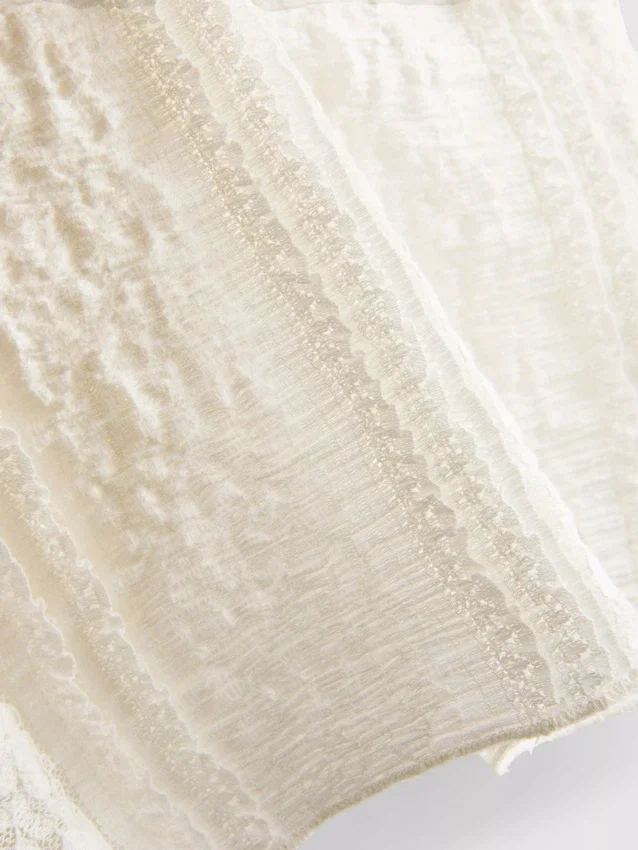 Bandeau-top i bomullsblanding med blonder
