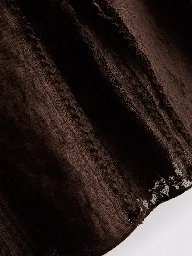 Bandeau-top i bomullsblanding med blonder