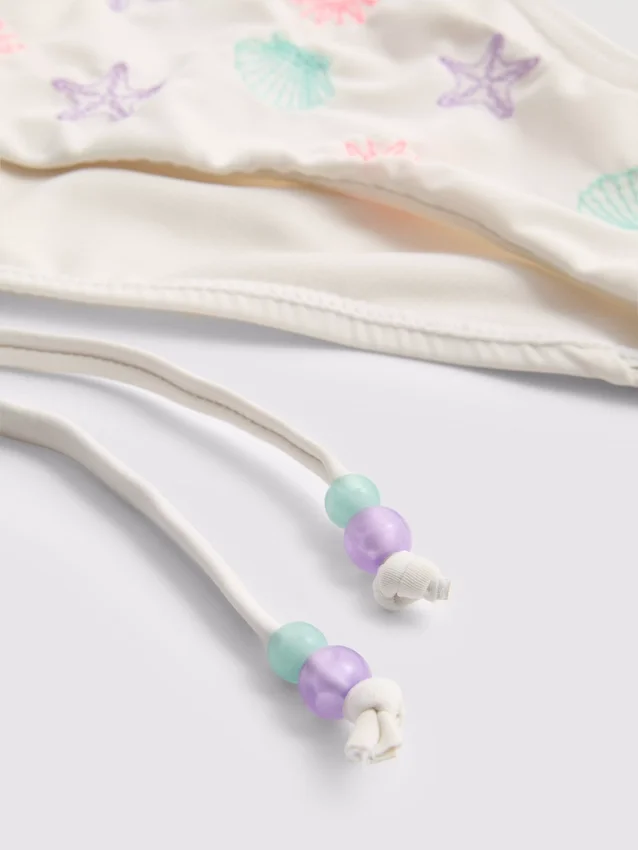 Bikinibukse med broderi og snøring i siden