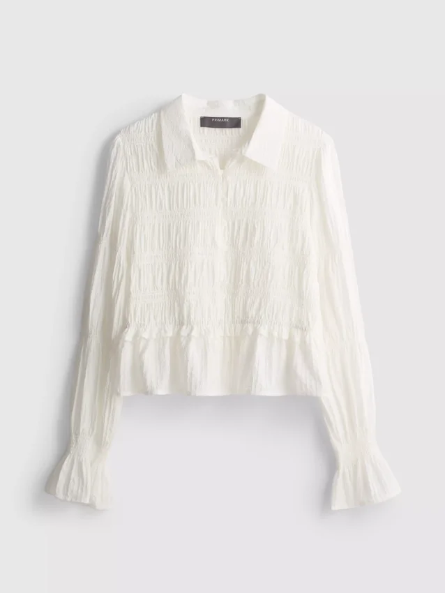 Bluse med rynket peplum-kant