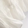 Bluse med rynket peplum-kant