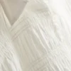 Bluse med rynket peplum-kant