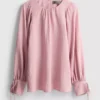 Bluse med strukturerte ballongermmer