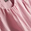 Bluse med strukturerte ballongermmer