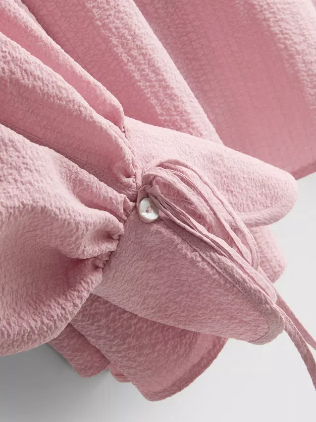 Bluse med strukturerte ballongermmer