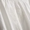Bomullsbroderte bukser med vide ben