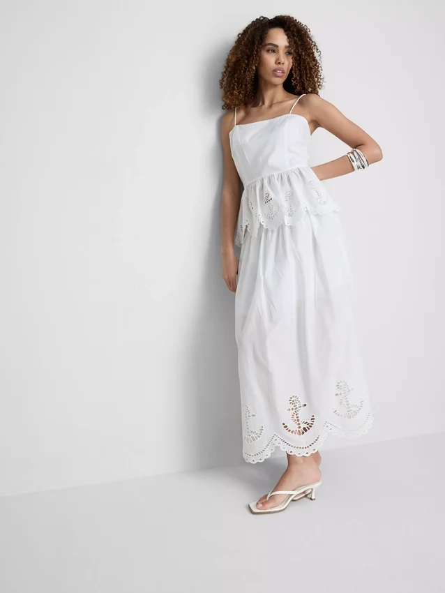 Cami-top i bomull med brodert peplum-kant