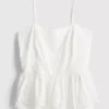Cami-top i bomull med brodert peplum-kant