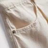 Denimshorts med plissering og utvidet ben, med høyt bomullsinnhold