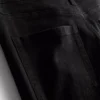 Flared-jeans i bomullsdenim med middels høy midje