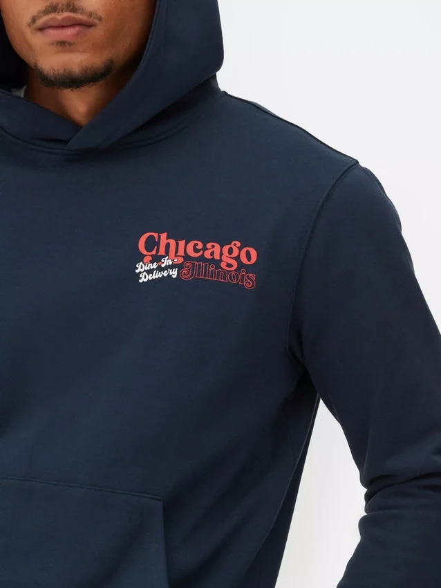 Hettegenser med «Chicago deep dish»-motiv
