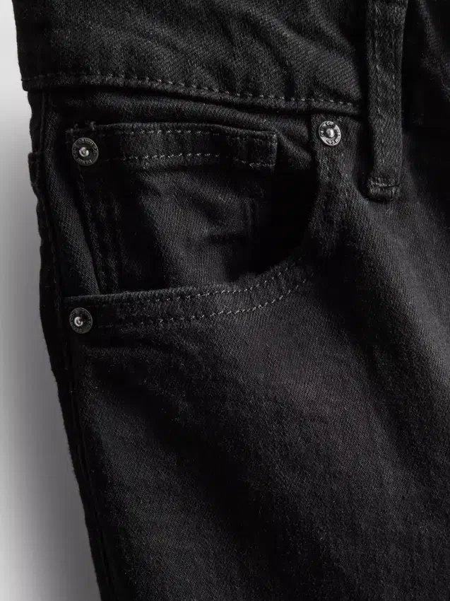 Jeans i bomull med middels høy midje og bootcut-passform