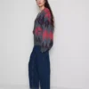 Jeans i bomullsdenim med høy midje og smalere ben