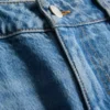 Jeans i bomullsdenim med middels høy midje og rette ben