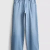 Jeans i bomullsdenim med middels høy midje og vide ben