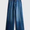 Jeans i bomullsdenim med middels høy midje og vide ben