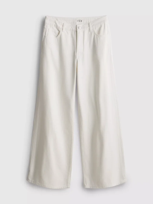 Jeans i bomullsdenim med middels høy midje og vide ben