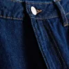 Jeans i bomullsdenim med middels høy midje og vide ben