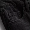 Jeans i bomullsdenim med middels høy midje og vide ben