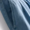 Jeans i bomullsdenim med plissert, vid ben