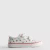 Lavt snøringssneakers i lerret med blomstermønster