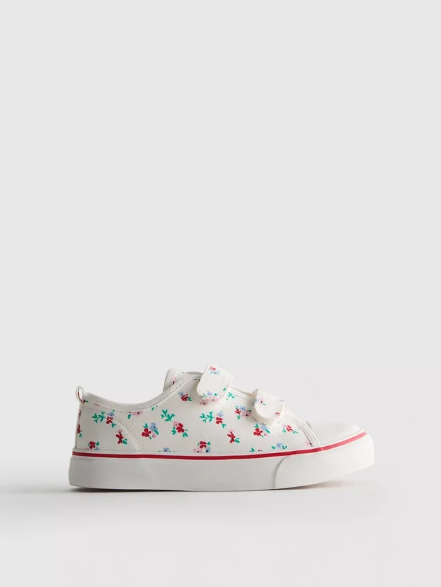 Lavt snøringssneakers i lerret med blomstermønster