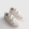 Lavt snøringssneakers i lerret med blomstermønster