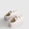 Lavt snøringssneakers i lerret med blomstermønster