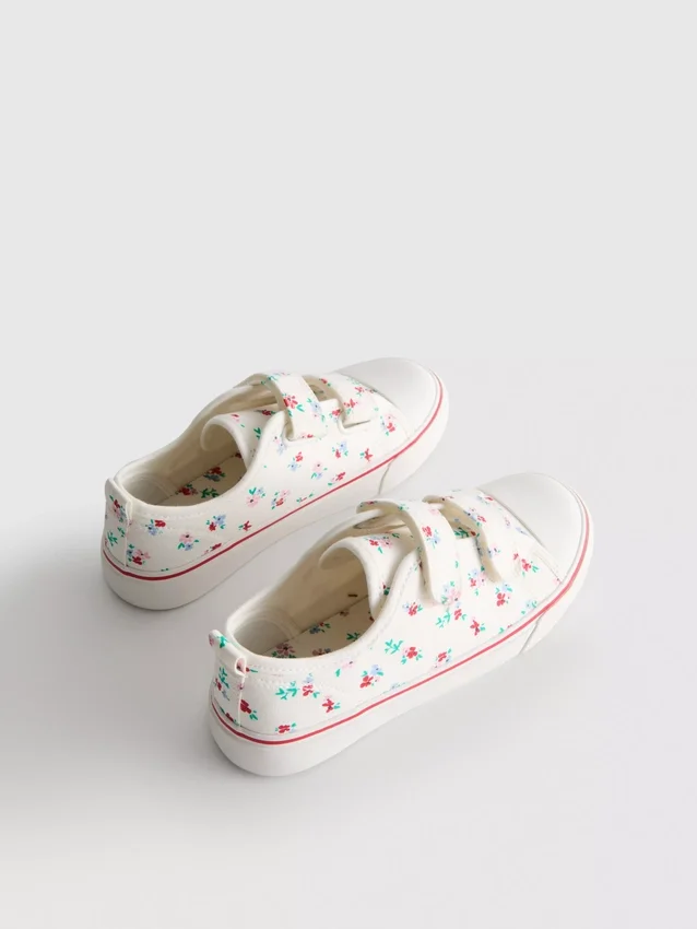 Lavt snøringssneakers i lerret med blomstermønster